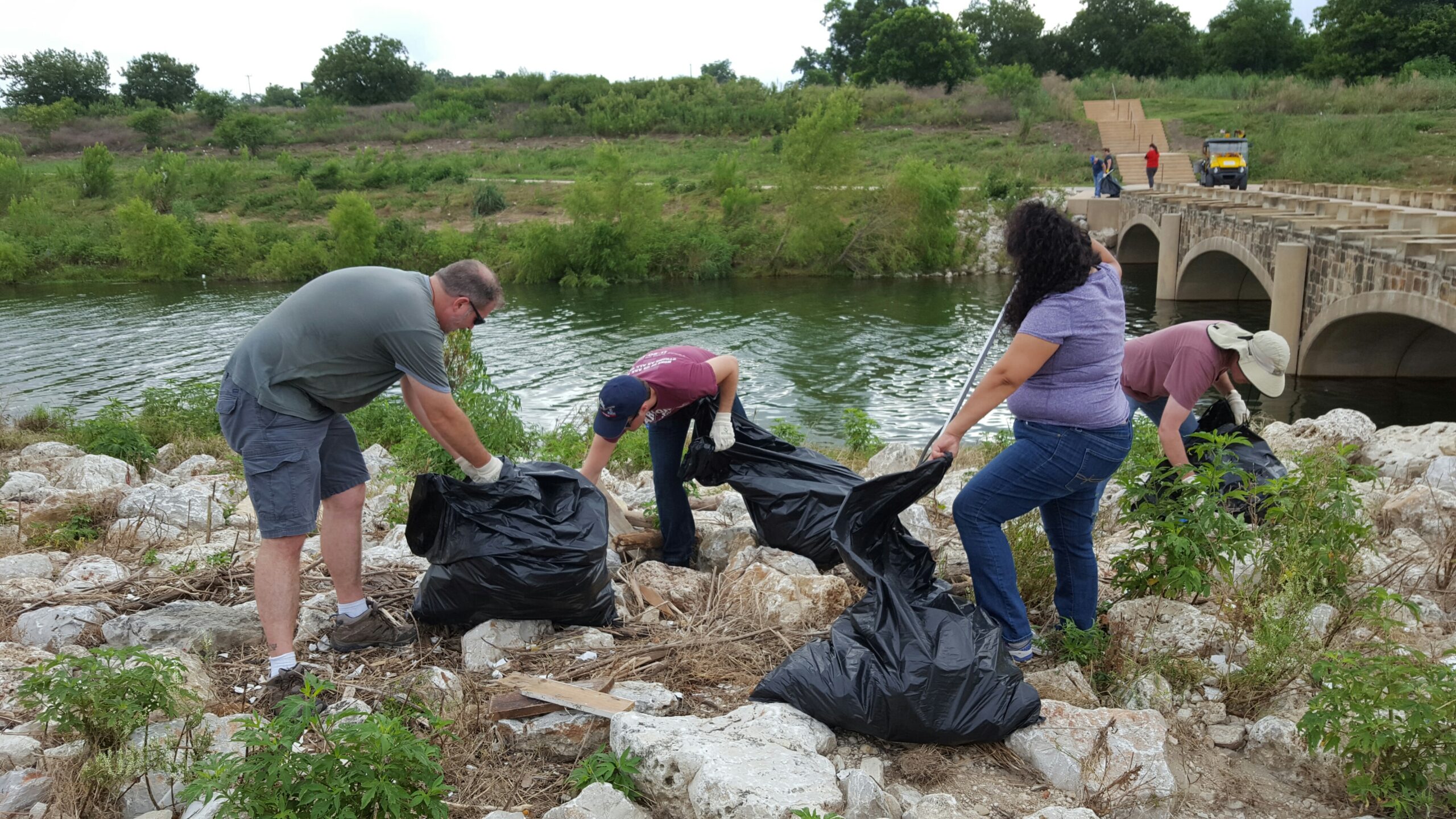 River Warrior volunteers taking part in post storm event cleanup on the Mission Reach San Antonio River Walk segment