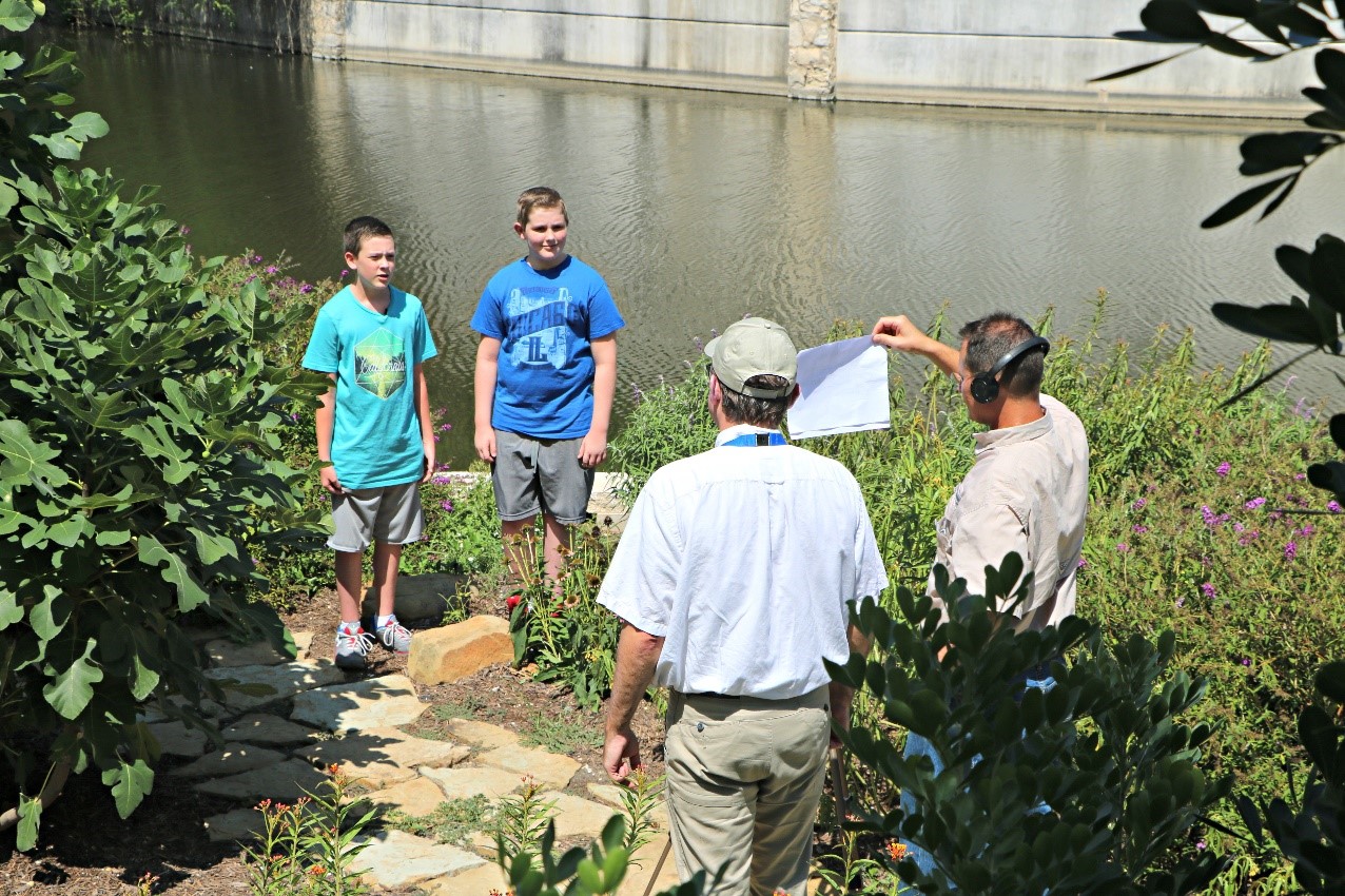 River Authority's Director of Human Resources kids participating in a stormwater runoff PSA in 2017