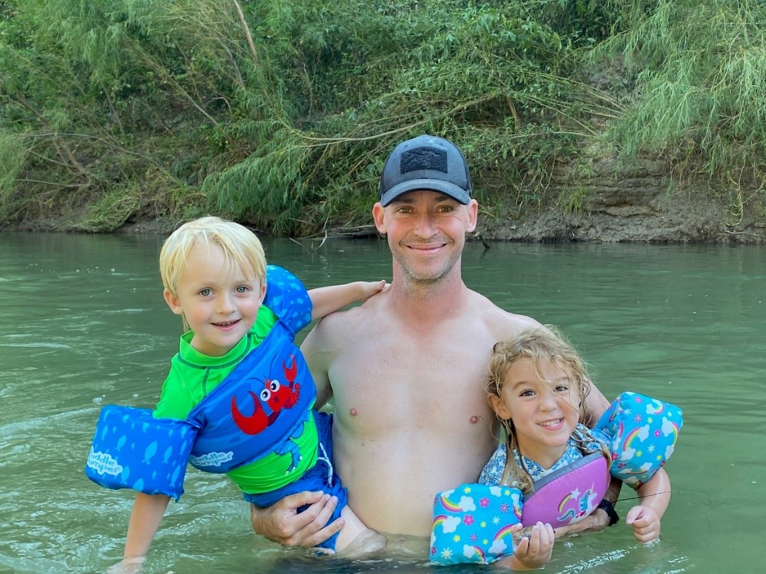 My oldest son John with my grandson. He also lives by the San Antonio River and enjoys recreating on the river with his family.