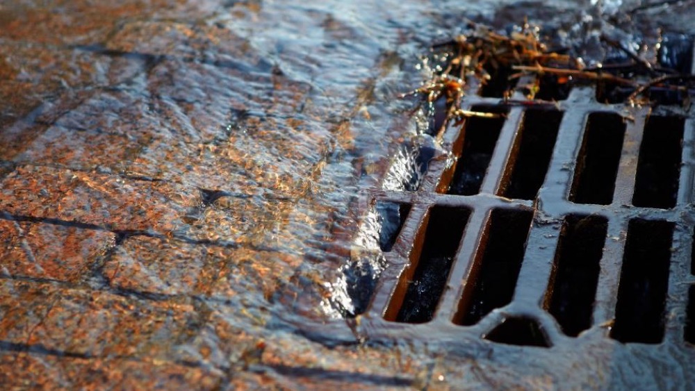 Stormwater going down a street drain