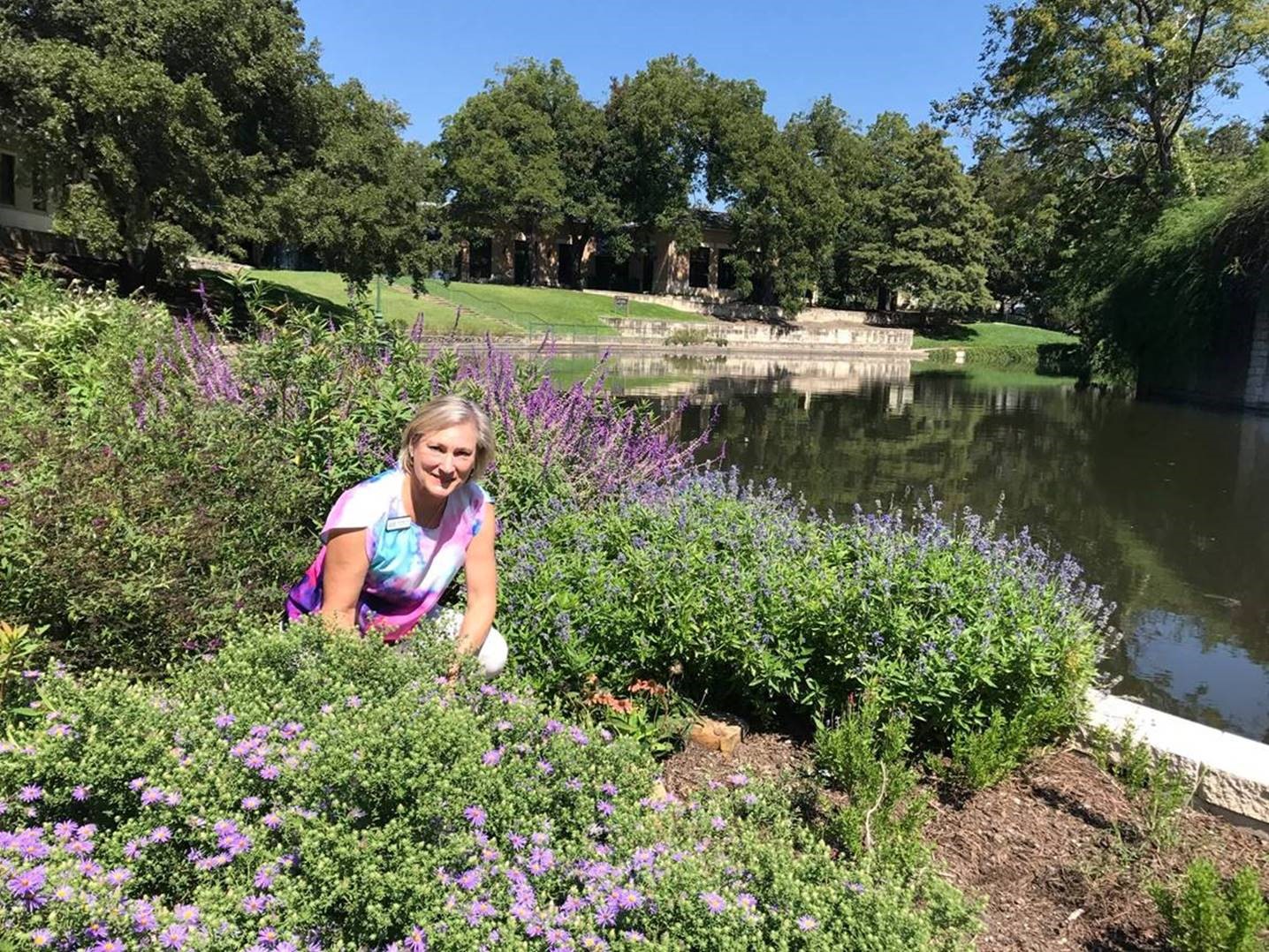 River Authority Board Member Deb B. Prost enjoying the pollinator garden outside of the River Authority’s headquarters. 