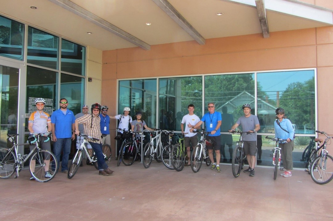 San Antonio River Authority staff pose in front of the installed bike racks at our Euclid office