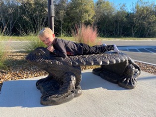 Dr. Fuller’s grandson enjoys the horned lizard sculpture at the Escondido Creek Parkway in Karnes County