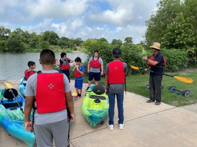 South San ISD students prepare to paddle the San Antonio River at Acequia Park 