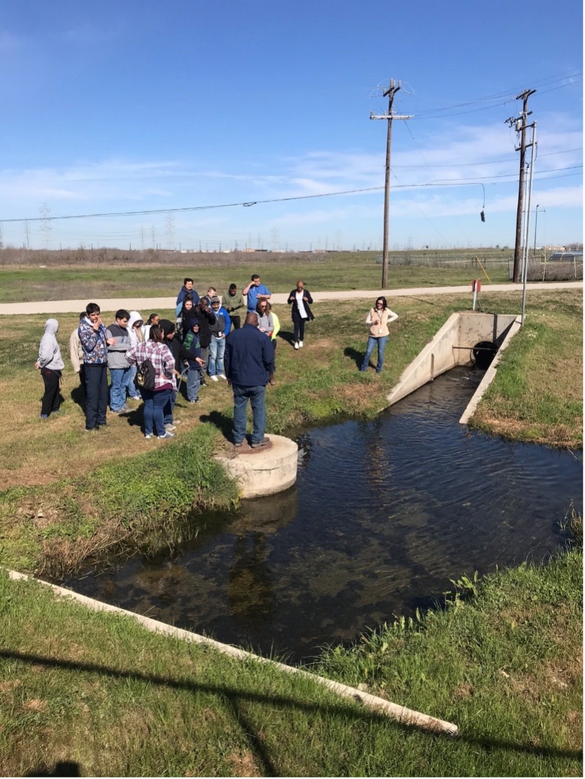 Group of students observe water runoff at the Martinez II waste water treatment plant.
