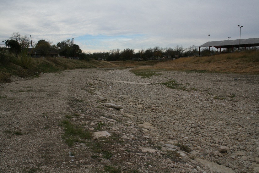 Barren waterway filled with rock and sediment
