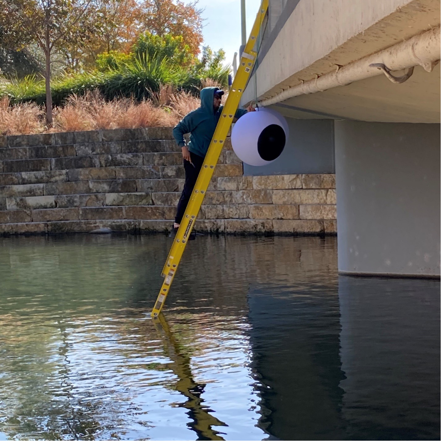 Artist Justice David Gutierrez installs pieces of temporary art installation 