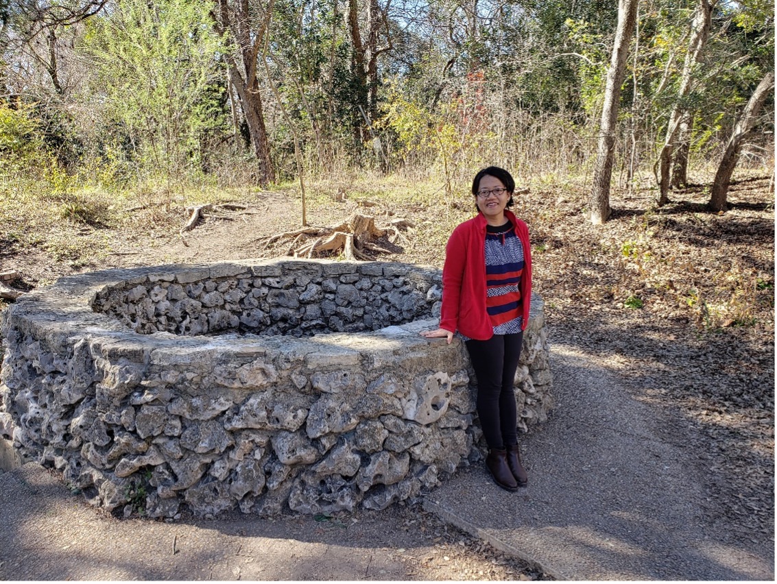 Michiko poses in front of the Blue Hole springs. 