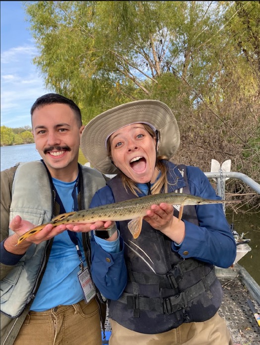 Aquatic biologists Steven Bittner and Angelica Rapacz hold the mystery fish!