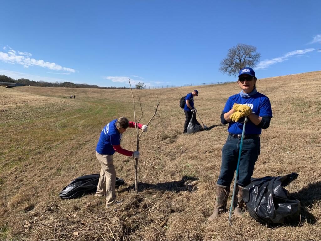 River Warriors clean up open field and plant tree