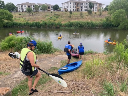 The newly formed River Warrior Paddling Crew helps clear litter from local creeks and the San Antonio River.
