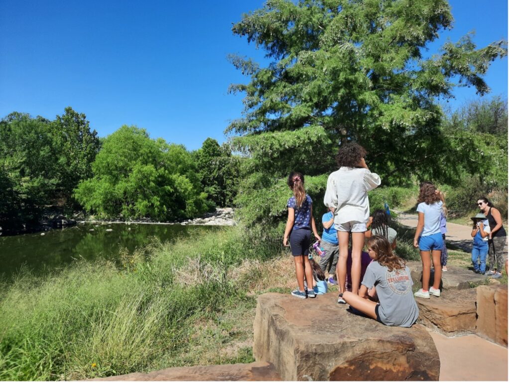Group of families enjoy the Mission Reach at the San Antonio River