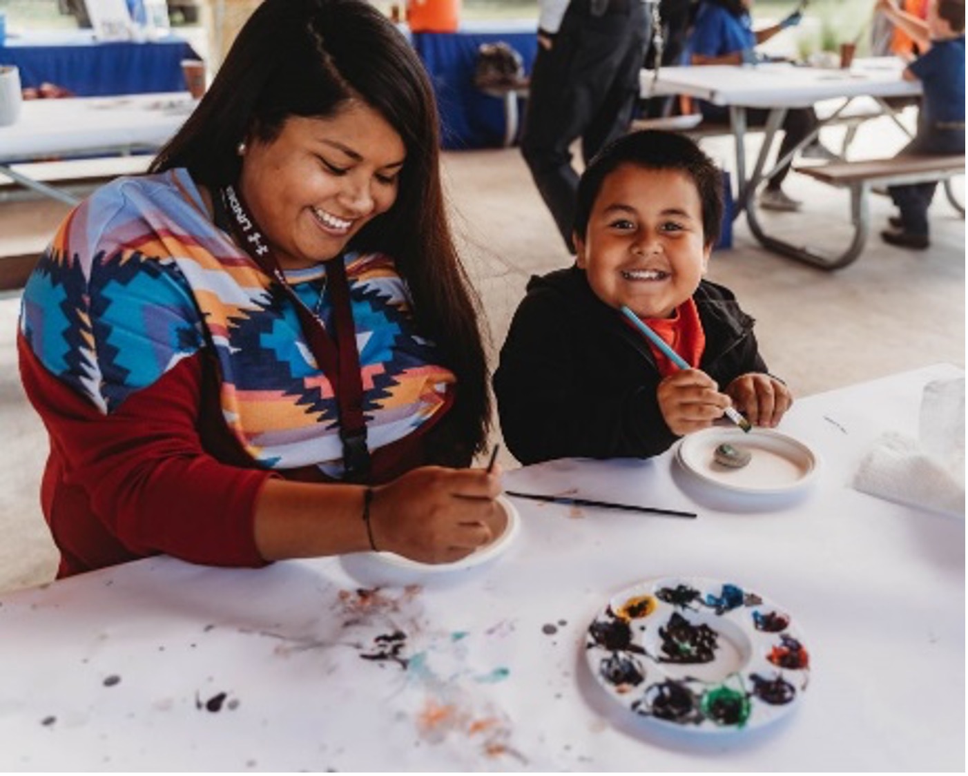 A Mother and Son paint rocks together.