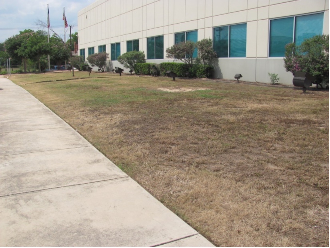 Before image of garden in front of Euclid River Authority building