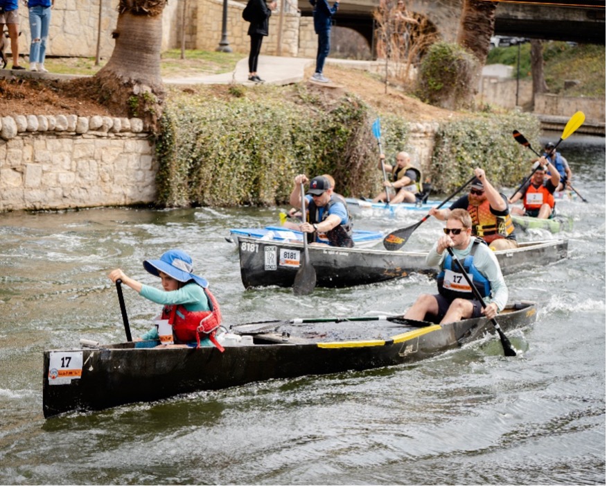 Paddling Racers take off from the starting line during the Battle of the Paddle Race.