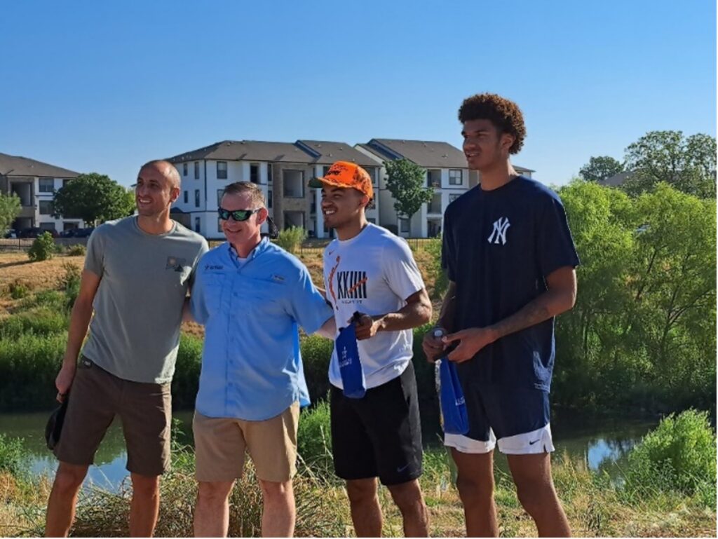 Team members Tre Jones, Dominick Barlow, and recent Hall of Fame inductee Manu Ginobili recently spent a day with the River Authority kayaking the Mission Reach and picking up some litter along the way.