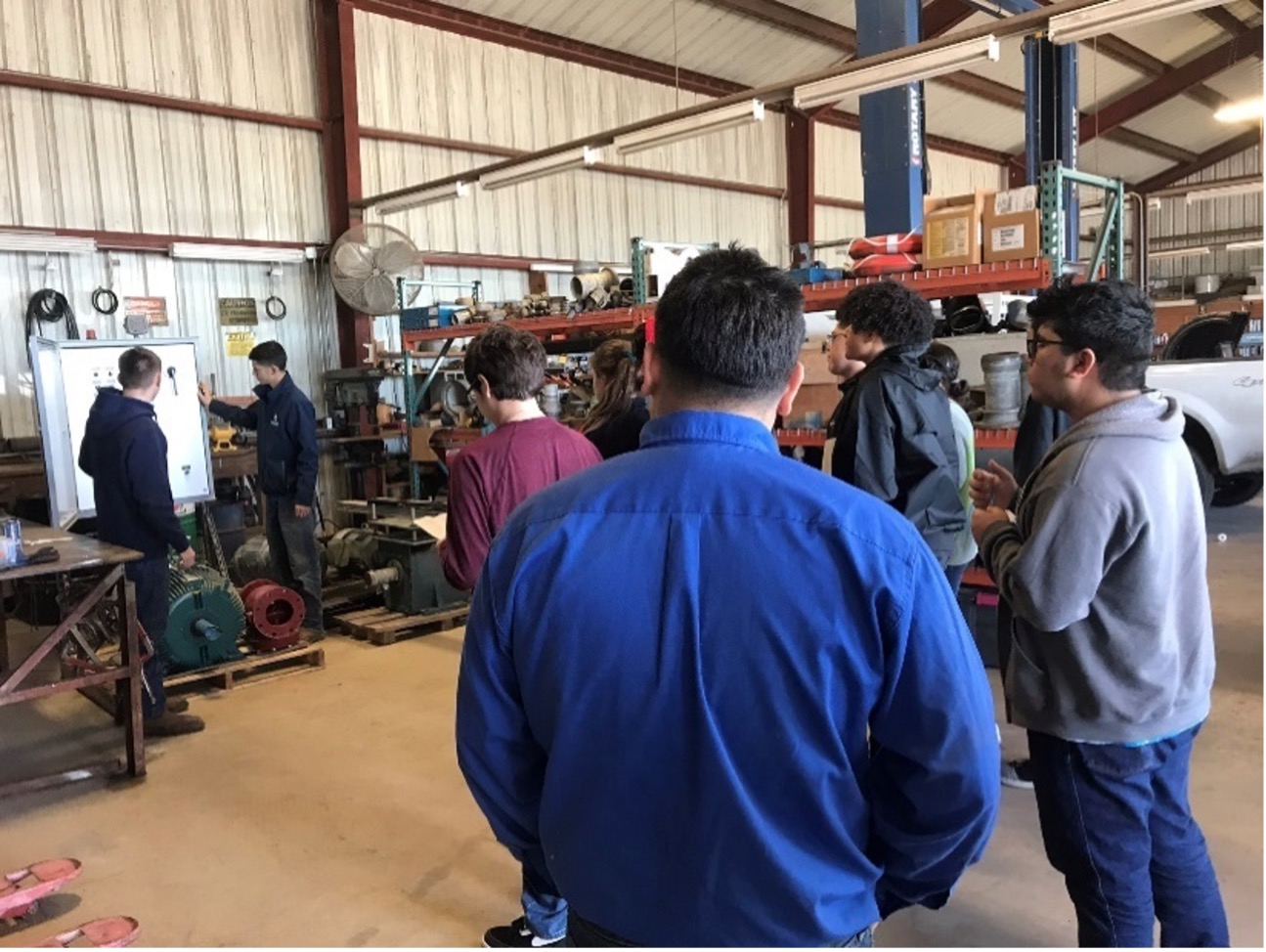 Maintenance Team demonstrating systems to students