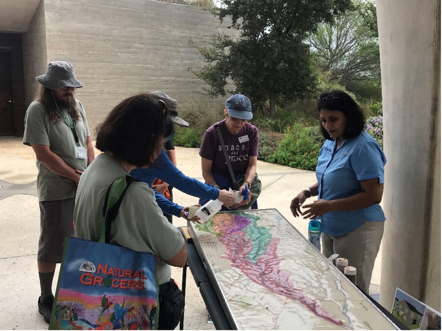 Engagement and Volunteer Coordinator Minna Paul leads demonstration of floodplains