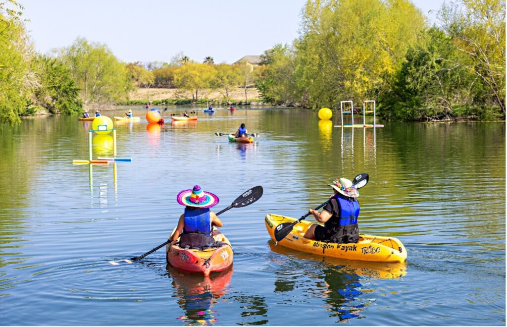 Kayak along the San Antonio River at the Fiesta Flotilla Event