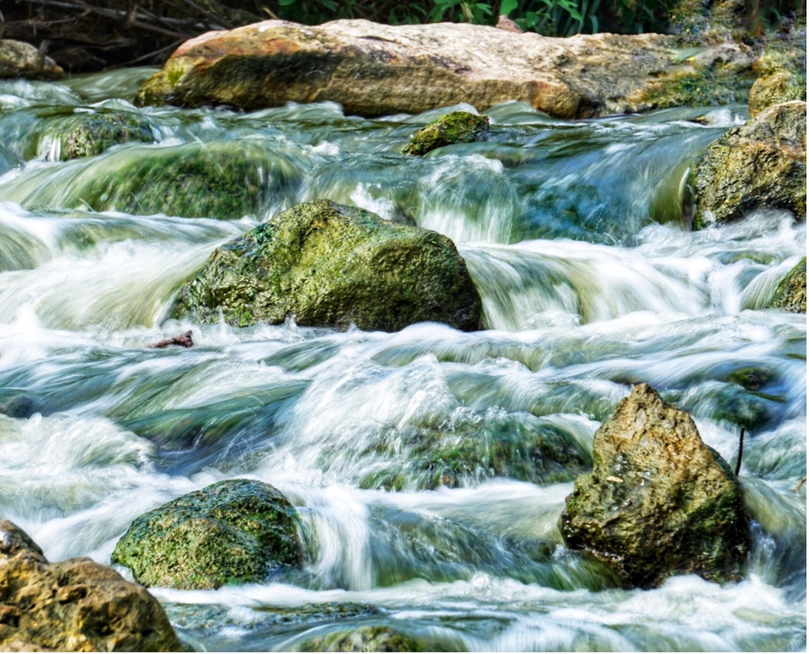 River water falls over large rocks