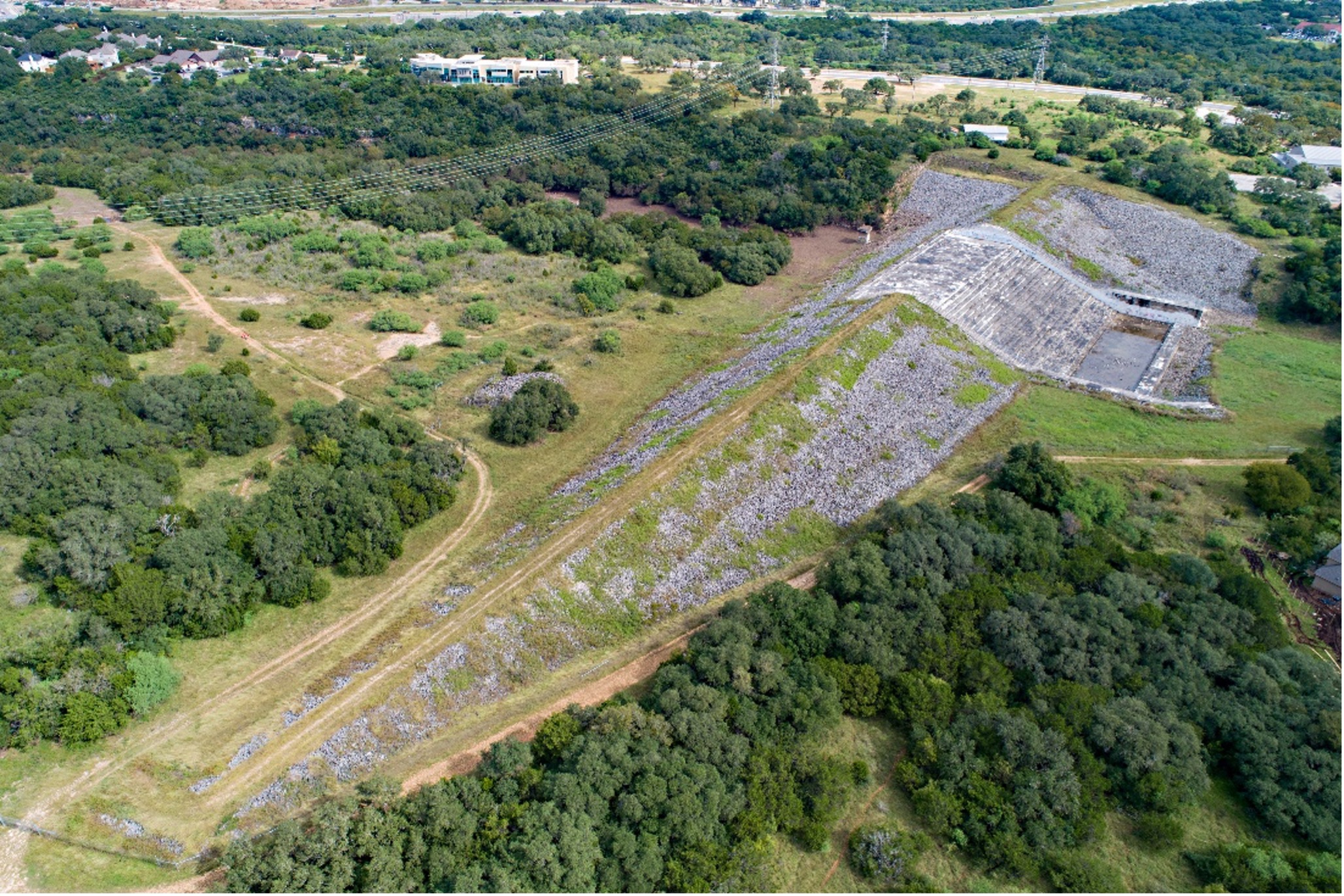 Mud Creek Park overhead view of trees, walkways and dams. 