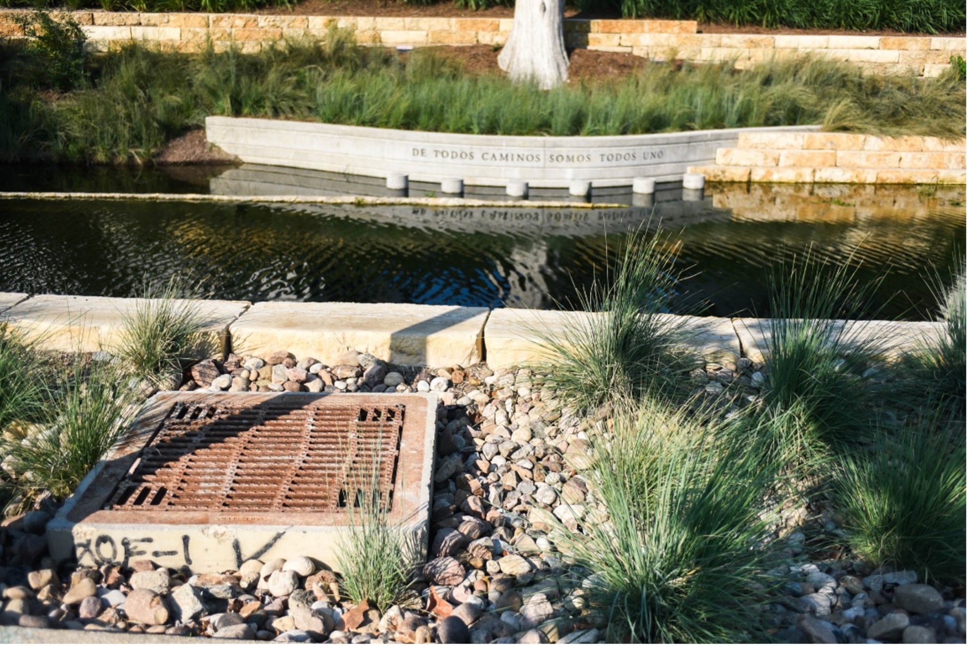A bioswale next to the creek. It is raised stone with an iron filtration on top.
