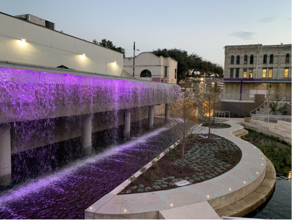 STREAM 250 foot waterfall lit up at San Pedro Creek Culture Park.