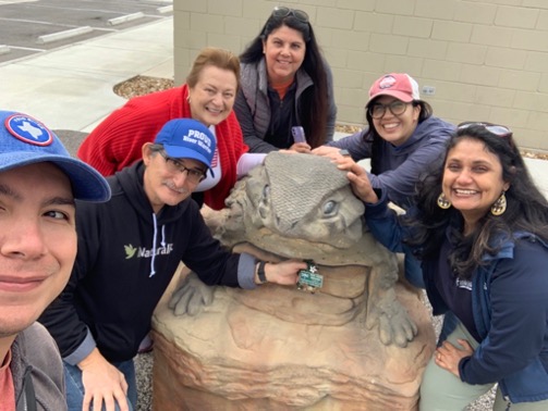 Volunteers gather around horned toad statue at Escondido Creek Parkway. 