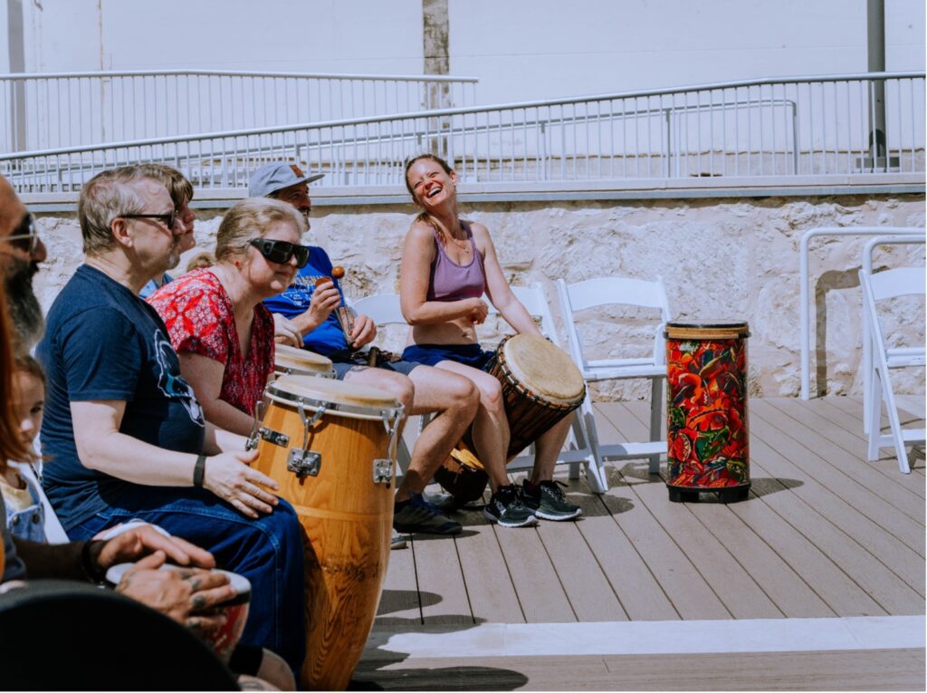 Drum Circle participants gather around during Creekfest.