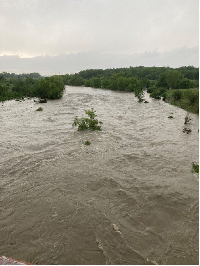 Mission Road flodded after large rain event.