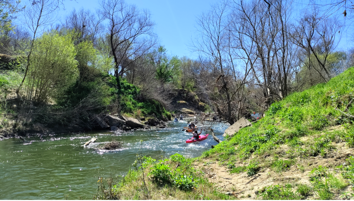 Kayakers take on the river rapids. 