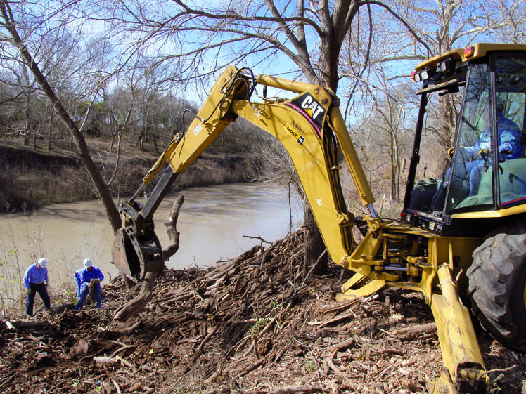 Crews removing log jam debris from river