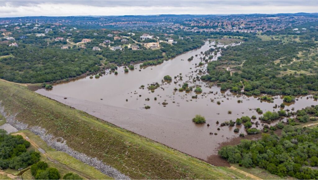 Aerial view of flood waters held back by levee