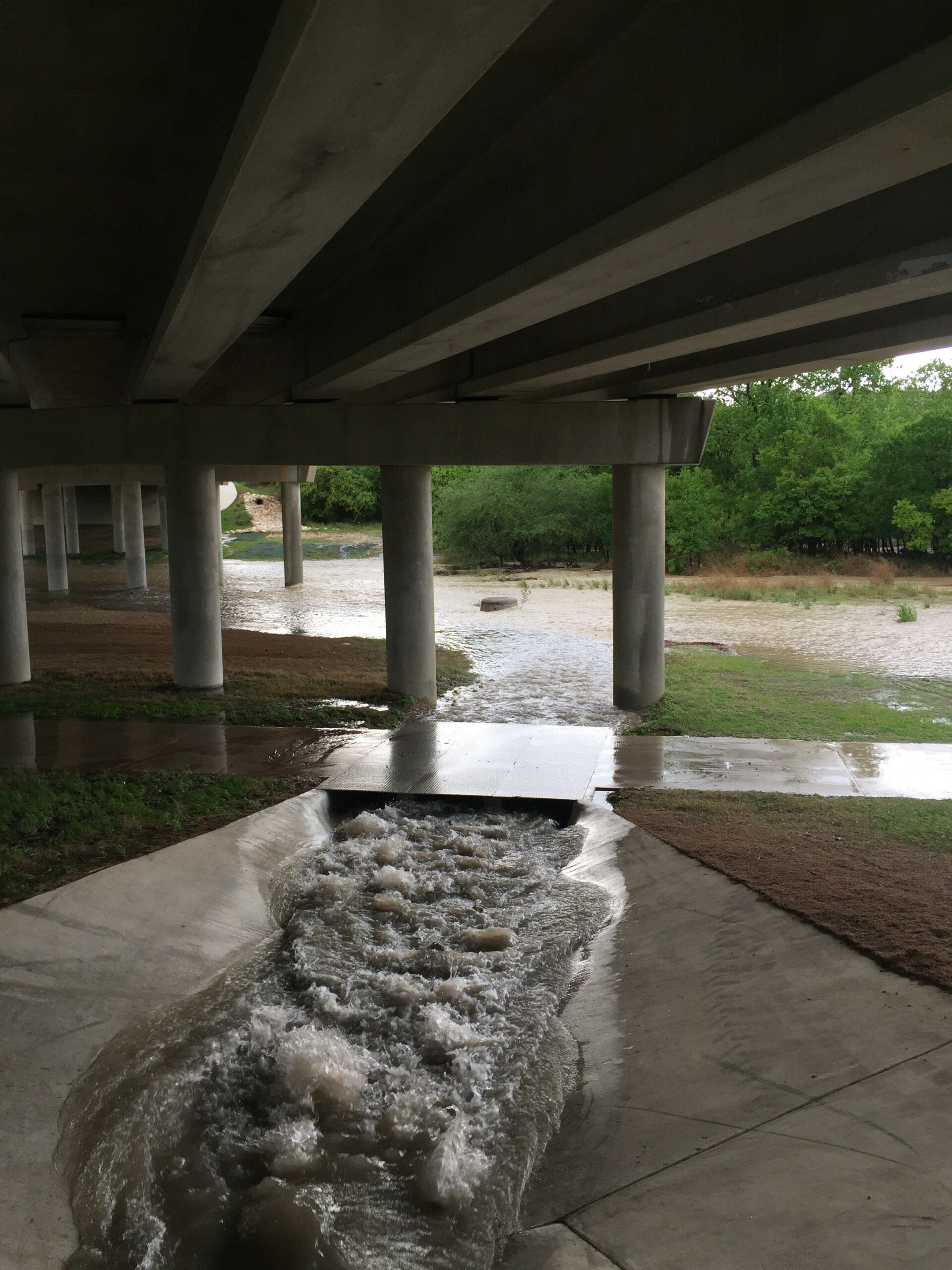 Storm water runoff under bridge