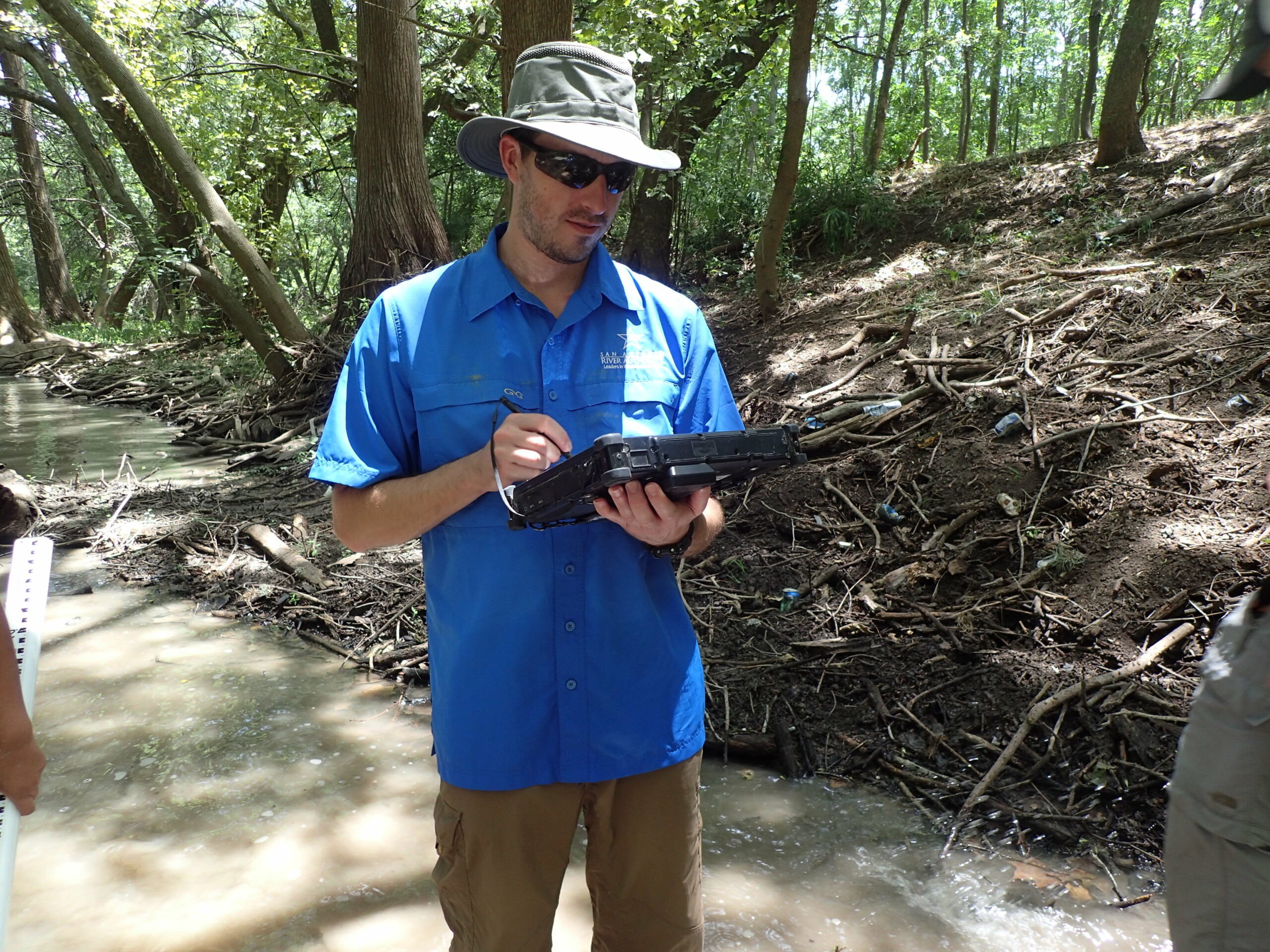 Ecologist wading in the river