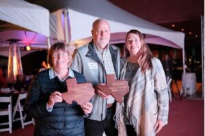 Three River Warriors stand with their awards