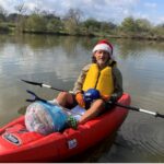 River Warrior sits in kayak