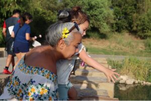 A woman and child admire the river.