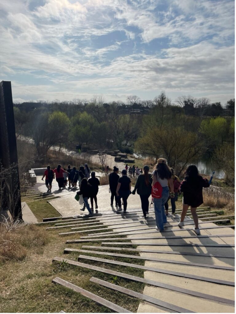 Students walk down the staircase