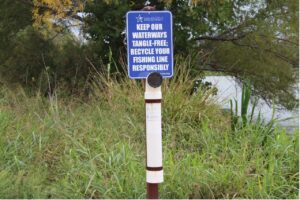 Sign that reads "Keep our waterways tangle-free; recycle your fishing line responsibly"