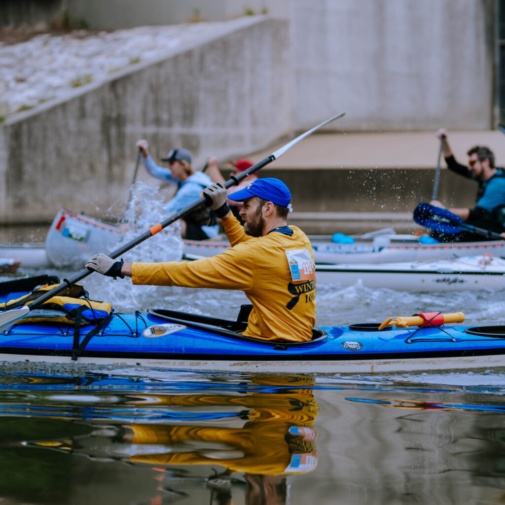 Paddling racers on the San Antonio River