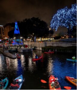 Kayakers approach River of Lights display