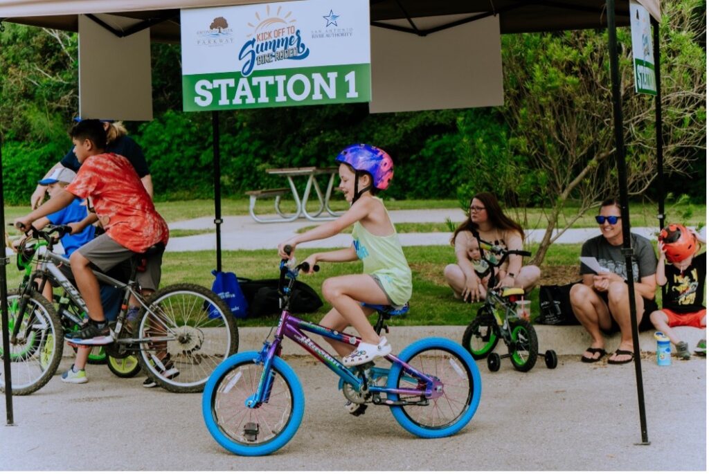 Children ride their bikes down a trail