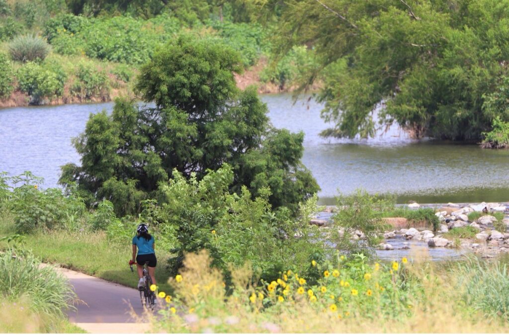 Person rides down the Mission Reach Bike Trail