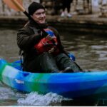 General Manager Derek Boese in a kayak