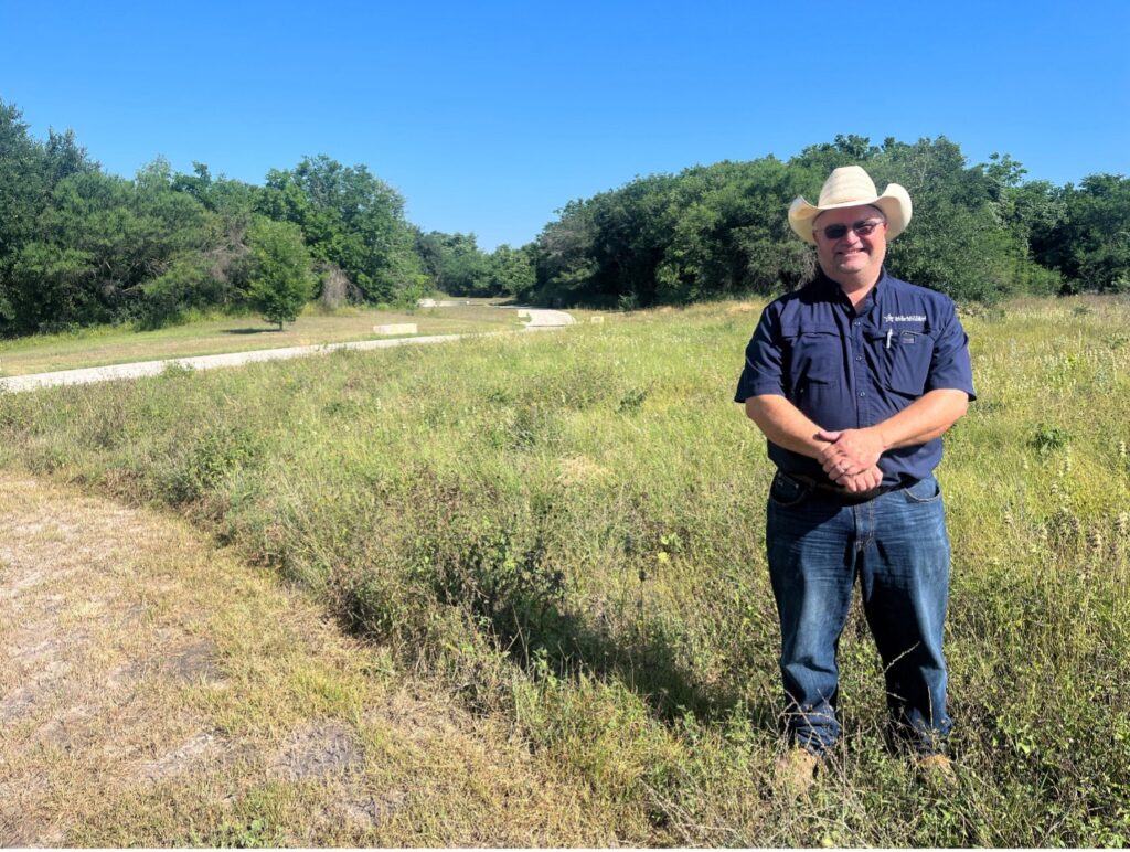 Benjamin Janysek near restored horned frog habitat