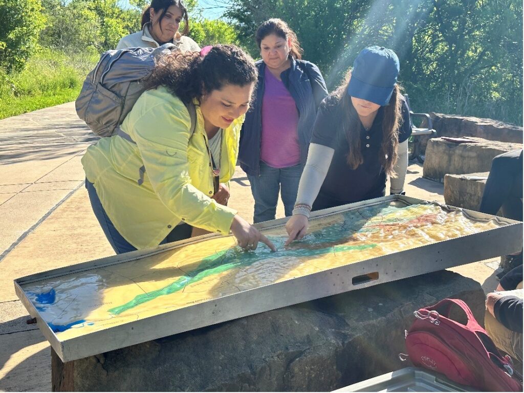 Students observe the flood model