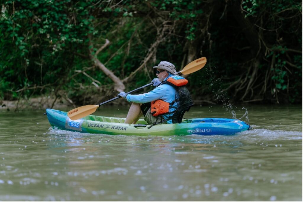 Derek Boese kayaks along the Mission Reach