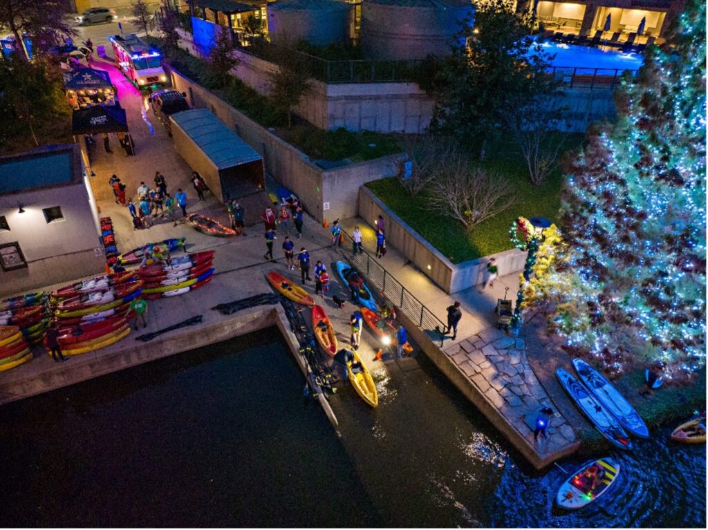 Aerial view of kayaks being directed to the river.