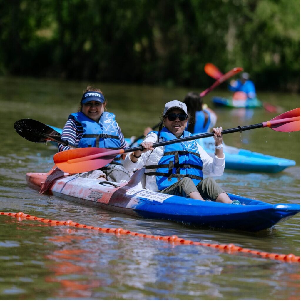 Two people kayaking in a tandem kayak